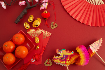 Chinese new year festival decorations. Orange, red packet, plum blossom and lucky money....