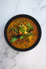 vegan yellow curry with broccoli and tofu cubes, healthy plant-based food
