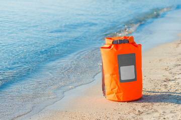 water proof bag on the sand beach