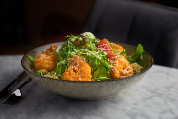 Healthy salad plate. Fresh seafood recipe. Grilled shrimps and fresh vegetable salad and egg. Grilled prawns. Healthy food. Flat lay