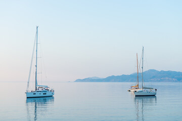 Obraz premium Sailing Yacht from sail regatta on mediterranean sea at sunset