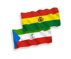 Obraz premium National vector fabric wave flags of Republic of Equatorial Guinea and Bolivia isolated on white background. 1 to 2 proportion.