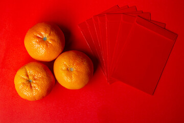 Chinese New Year Concept - Mandarin oranges and red packet