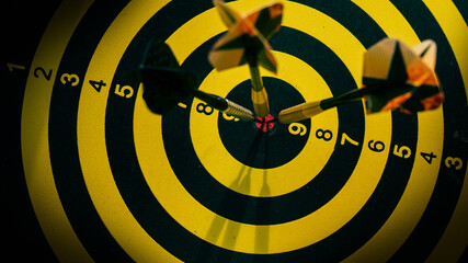 three darts hit the center of dartboard, goal strategy concept