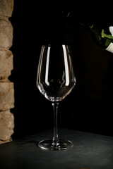 clean empty wine glass against dark background