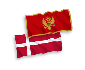 National vector fabric wave flags of Denmark and Montenegro isolated on white background. 1 to 2 proportion.