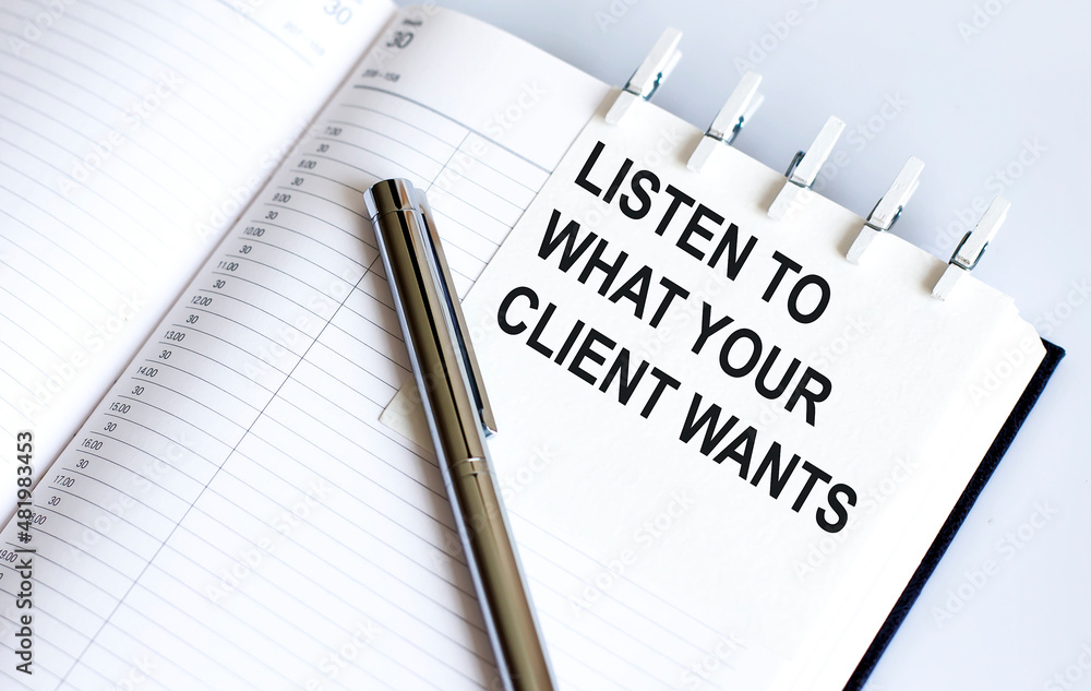 Poster text listen to what your client wants on the short note texture background with pen