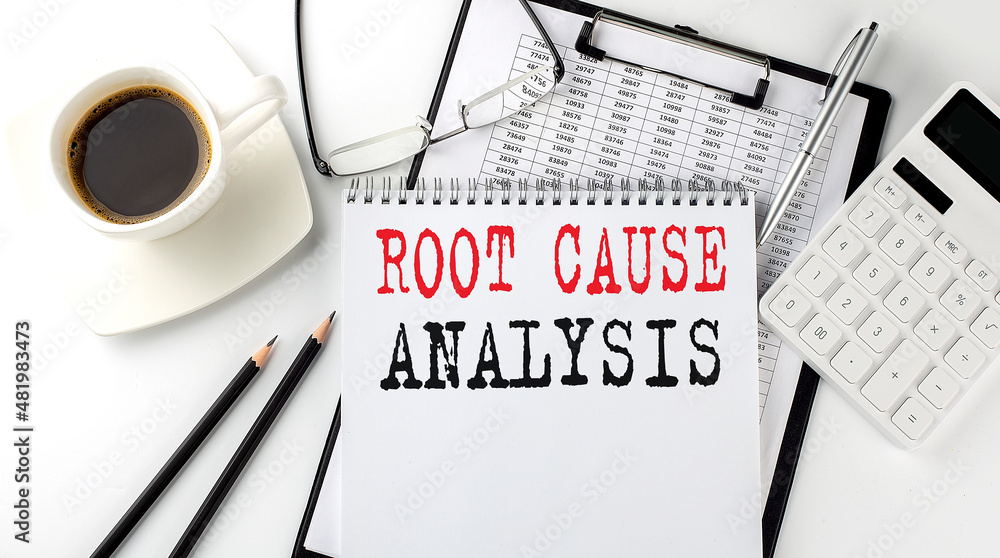Aufkleber root cause analysis text on the paper with calculator, notepad, coffee ,pen with graph