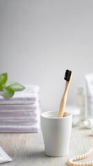 Aesthetic light life style picture with eco-friendly Bamboo toothbrush and bathroom accessories.