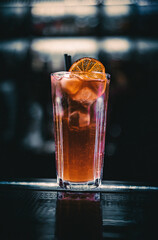 glass of long island cocktail at bar counter
