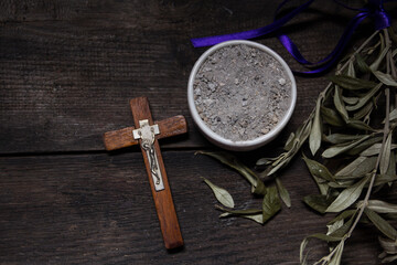 bowl with ashes and olive branch. ash wednesday concept - obrazy, fototapety, plakaty