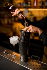 beautiful view of steel shaker cups on the bar counter