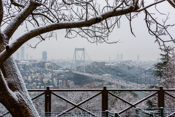 Snowy day in Istanbul, Turkey. View of Fatih Sultan Mehmet Bridge from Otagtepe. Beautiful winter...