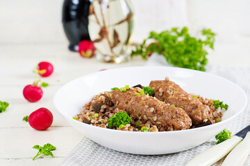 Healthy dinner. Lunch bowl with buckwheat porridge, baked meat cutlets and roasted eggplants.