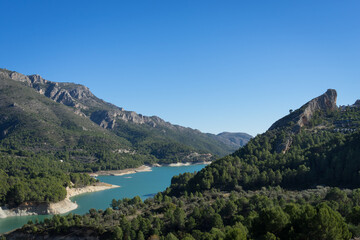 Obraz na płótnie Canvas beautiful turquoise mountain lake in Spain and scenic mediterranean landscape
