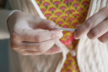 young women hand cutting finger nail 