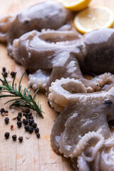 Baby octopus with lemon and rosemary. Selective focus