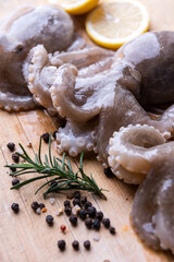 Baby octopus with lemon and rosemary. Selective focus