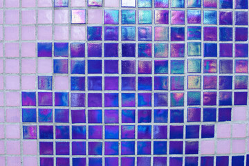 Blue pink mosaic square for background texture. Detail of a beautiful old folding abstract ceramic mosaic. Venetian mosaic. Colored ceramic stones. Very peri. background of tiles violet tones on wall
