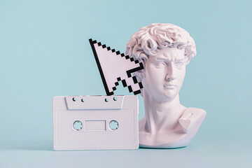 Antique statue is bust of David and pixel mouse pointer and audio cassette. - obrazy, fototapety, plakaty