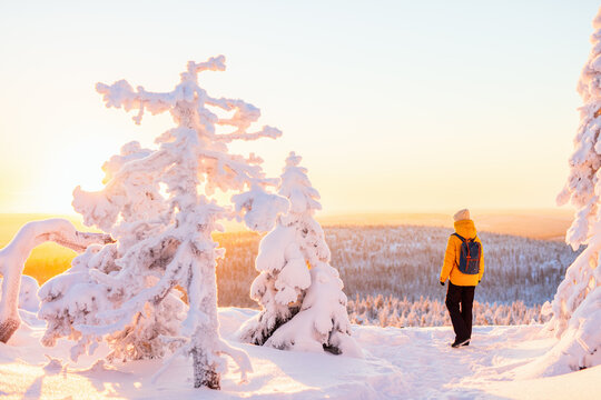 Young woman in winter forest in Finland