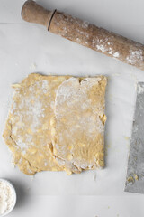 danish pastry dough being laminated, pastry dough with pieces of cold butter, process of laminating...