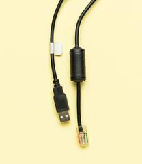 Internet and USB cables on beige background