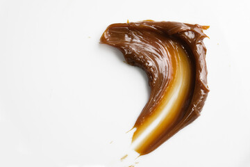 Smear of Caramel Sauce on a White Dish
