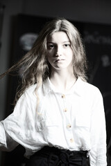 Naklejka premium Portrait of a young beautiful long-haired girl. Vintage black and white photo.