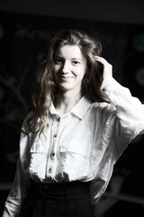 Portrait of a young beautiful long-haired girl. Vintage black and white photo.