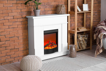 Interior of modern living room with mantelpiece, firewood and shelving unit