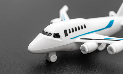 Airplane toy on black background. Close up.