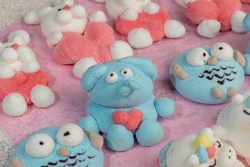 Marshmallow in the form of handmade animals on a light background. In a cup of coffee. Women's Day,...