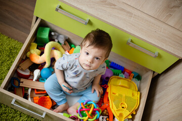 child toddler playing toys at home or nursery