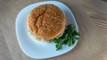 Delicious hamburger with cutlet and cheese on white plate baclground. Image for design menu.