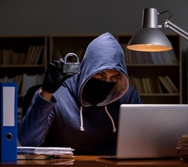 Hacker stealing personal data from home computer