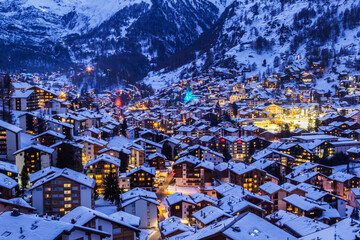 Zermatt town at twilight during Christmas illumination. Zermatt is a famous recreational place for outdoor activities for vacations