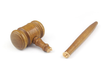 Broken wooden judge gavel isolated on white background. Concept of iniquity, injustice and lawlessness.