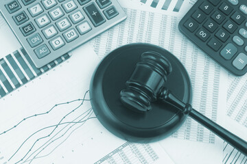 Arbitration and taxation concept, judge gavel and calculators on financial documents