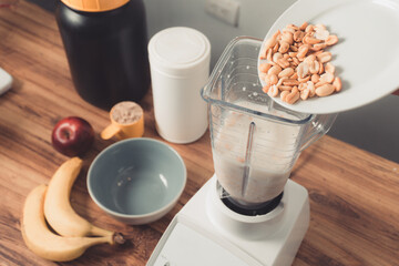 Preparation of protein smoothie with peanuts.