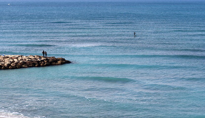 Naklejka premium Tranquil scenery. Blue sea water, sand, no people. Beautiful day on a beach.