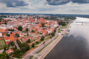Summer view of Torun old town and Jozef Pilsudski bridge.