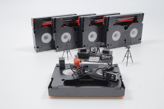 a mini figure with media studio on the DV tape