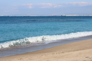 Golden sand, blue sea, calm water. Beautiful seascape. 