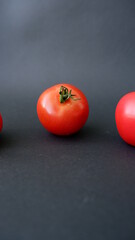 tomatoes on a black background