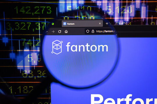 Fantom crypto company logo on a website, seen on a computer screen through a magnifying glass.	