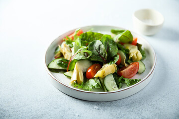 Artichoke salad with tomatoes and cucumber