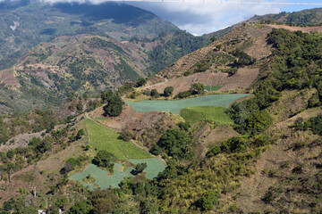 Dramatic image of Caribbean farming and agricultural fields high in the mountains of the Dominican Republic.
