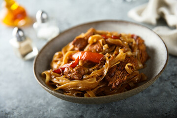 Homemade rice noodles with meat and vegetables