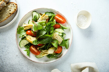 Artichoke salad with tomatoes and cucumber